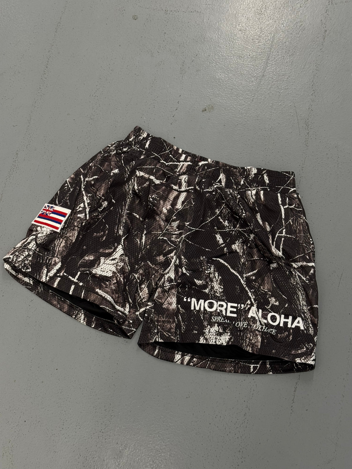 “MORE” ALOHA BLACK CAMO MESH SHORTS