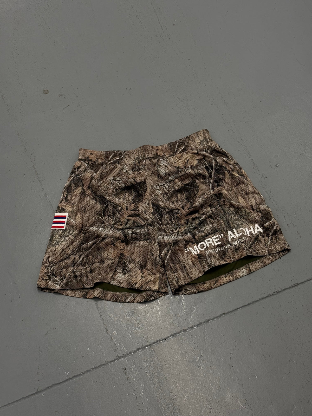 “MORE” ALOHA CAMO MESH SHORTS